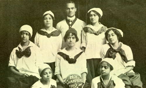 The New York Girls basketball team, managed and coached by Conrad Norman (standing, center). Norman later married one of his star players, center Dora Cole (standing, right). Dora’s sister Carrie (seated, far right) played forward. The New York Girls basketball team, managed and coached by Conrad Norman (standing, center). Norman later married one of his star players, center Dora Cole (standing, right). Dora’s sister Carrie (seated, far right) played forward.