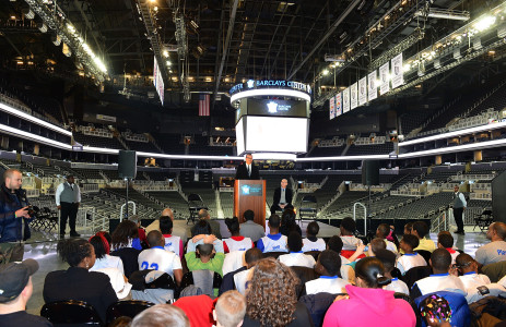 Black Fives Foundation founder Claude Johnson honors the legacy of Brooklyn's African-American basketball history through the installation of six large-scale photographs of the Black Fives at Barclays Center on February 4, 2013 in the Brooklyn borough of New York City. (Photo by James Devaney/WireImage)