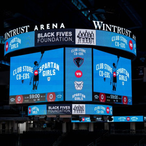 The scoreboard at Wintrust Arena, Chicago, home court for the DePaul University women's basketball team, representing the Club Store Co-Eds during their Black Fives Day commemoration, 2023. Opponent was Butler University, representing the Spartan Girls.